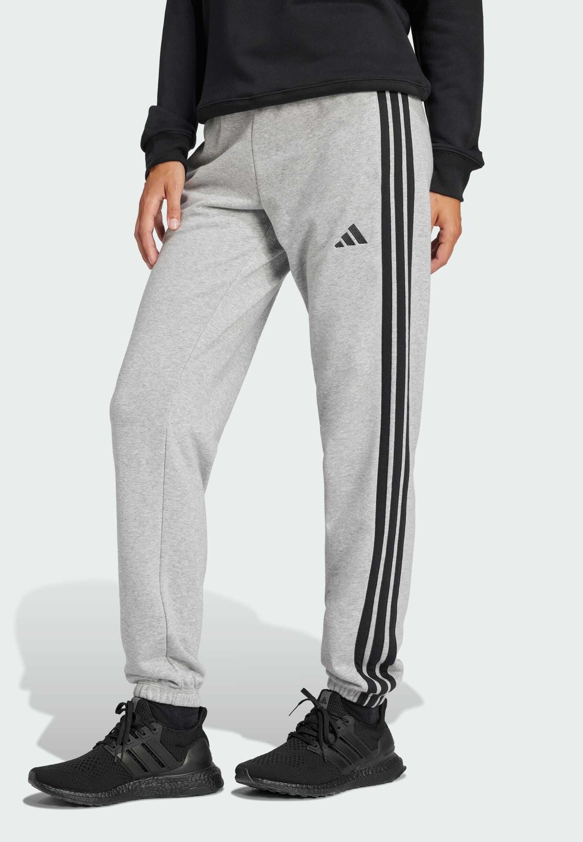 adidas Sportswear Essentials 3 Stripes Cuffed Pants – Pantalon de survêtement Femme – medium grey heather   black/gris chiné